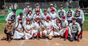 Ladies dressed in vintage baseball uniforms at Warren Ballpark